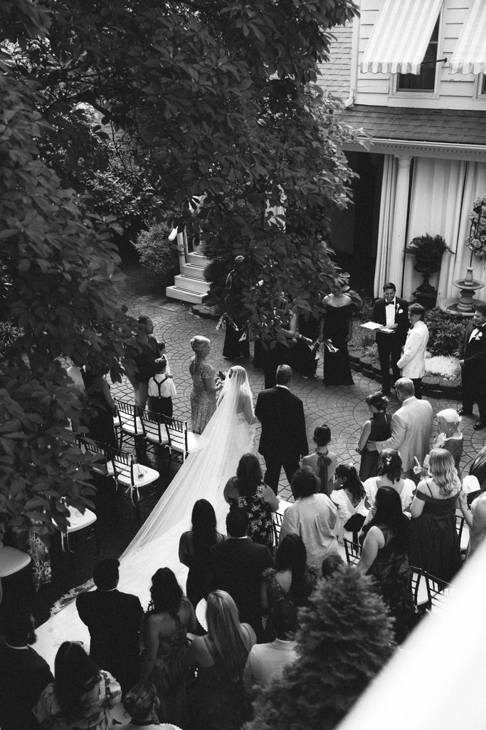 Black and white view from above of Bethany and Ethan's courtyard wedding ceremony at The Morehead Inn in Charlotte